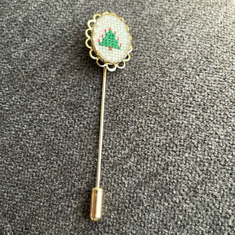 Vintage crossstitch lapel pin/stick pin.Hard to find.Gold tone w/ Christmas tree